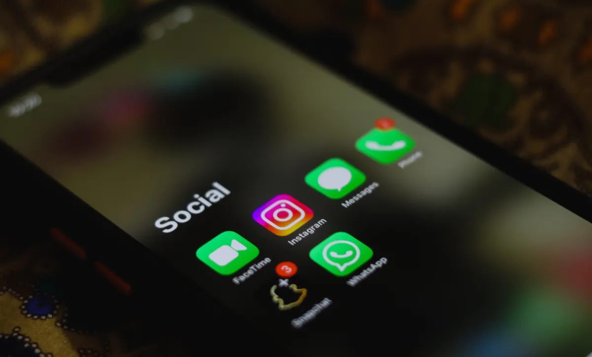 A phone screen showing a grid of social media application icons.