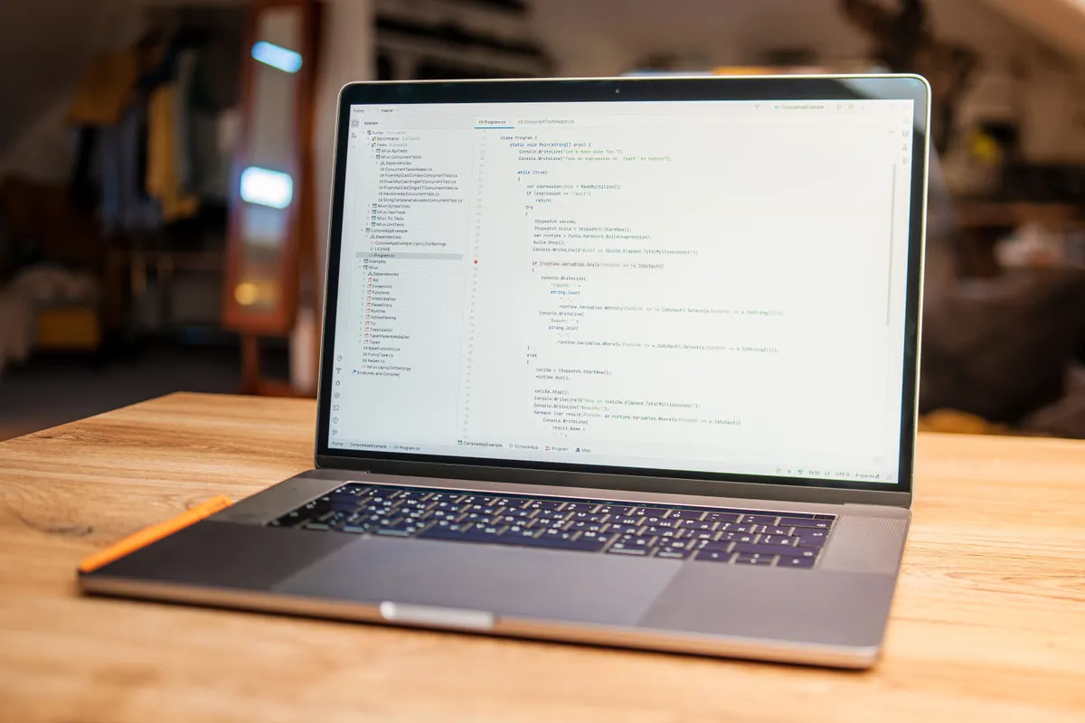 A laptop screen showing lines of code in an editor.